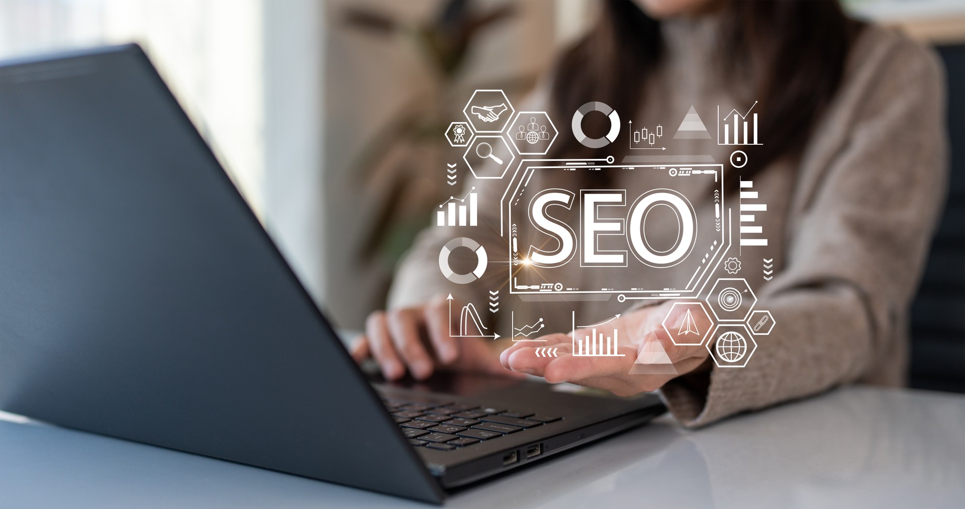 Search Engine Optimization (SEO). Woman using computer to analyze data statistics reports to improve your marketing strategy to be more effective in search rankings to increase your sales and traffic.